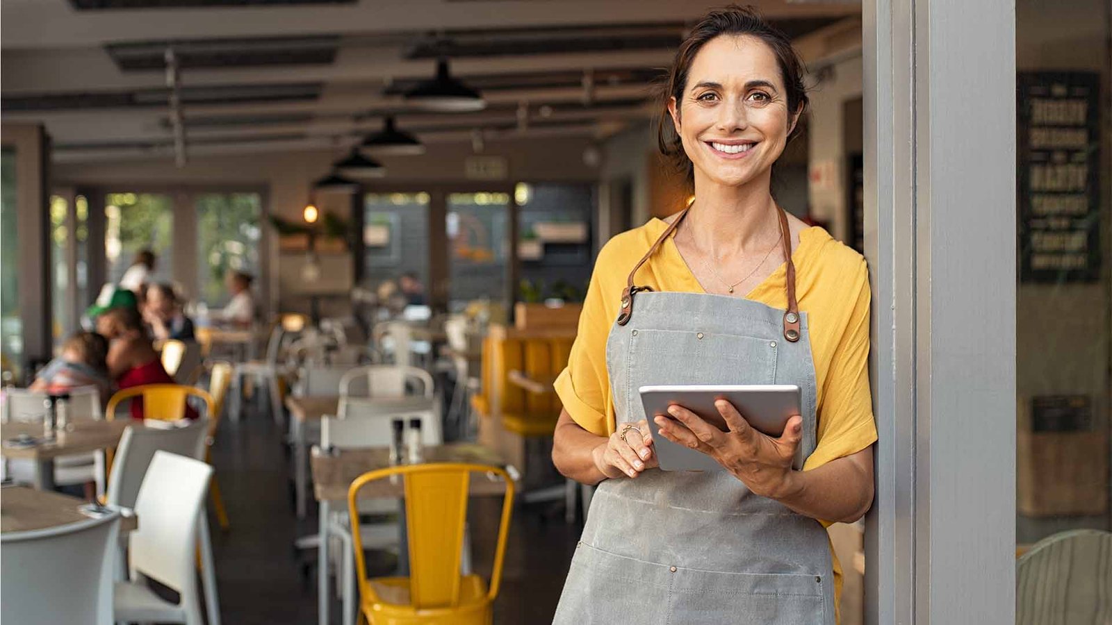 Happy business woman being shown her marketing results given by Xander Strategies